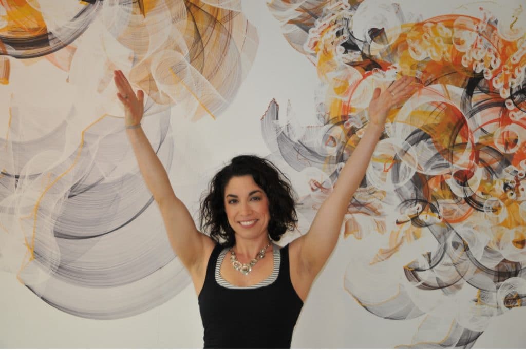 Featured- Healthy female fitness coach with arms in the air- Title- Five Biggest Nutritional Myths About Working Out