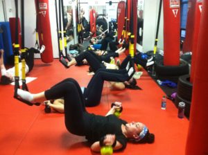 Featured- TRX group fitness class working core muscles